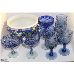 FLAT WITH BLUE WINE/MARGARITA GLASSES AND FLOWER