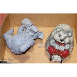 A GARDEN HEDGEHOG AND A PIG FIGURINE