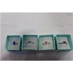 FOUR LADIES DINNER RINGS
