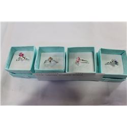 FOUR LADIES DINNER RINGS