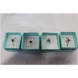 FOUR LADIES DINNER RINGS