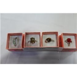 FOUR GEMSTONE RINGS