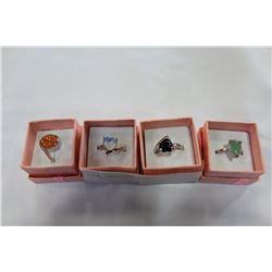 FOUR GEMSTONE RINGS