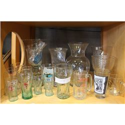 SHELF LOT OF COKE AND 7-UP GLASSES MUGS AND VASES