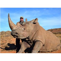 7 day trip for one hunter and one non-hunter for the chance to dart a white rhino in South Africa