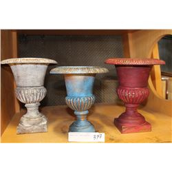 LOT OF THREE CAST IRON PLANTERS