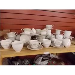 TEA CUPS AND SAUCERS