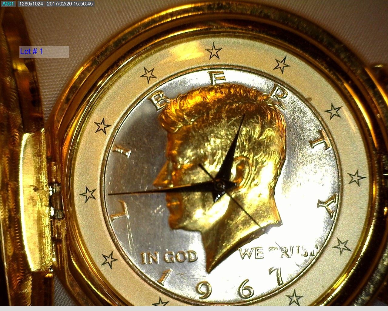 Pocket Watch with Gold colored Watch Chain. Dial is made from a silver