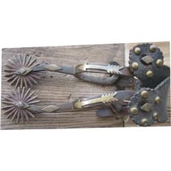 Indian made spurs mounted with arrows