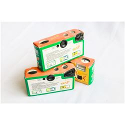 THREE DOZEN PING PONG BALLS AND THREE INSTAMATIC CAMERAS