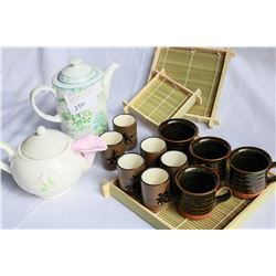 EASTERN BAMBOO TRAYS WITH TEACUPS AND TWO TEAPOTS