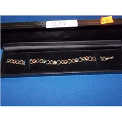 GOLD BRACELET WITH STONES