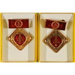 2-EAST GERMAN SOCIALIST MEDALS IN PLASTIC CASES