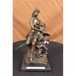 Nude woman and swan statue on marble base sculpture