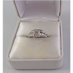 14KT WHITE GOLD LADIES RING (WED SET SOLDERED TOGETHER) SET WITH 1 DIAMOND AND 16 OTHER DIAMONDS.