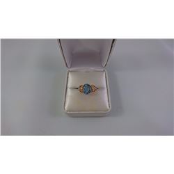 14KT YELLOW GOLD LADIES RING SET WITH ONE OVAL PROBABLE BLUE TOPAZ + 2 SCD TW 3.3 GRAM