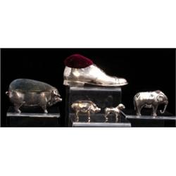 An Edwardian style pin cushion in the form of a standing dog, lacks velvet padding to it's back,...