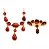 Image 1 : An early 19th Century necklet and matching brooch, set with foiled flat cut almandine garnets. Se...