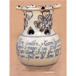 A Liverpool blue and white delft puzzle jug, circa 1750, with pierced neck, loop handle and three...