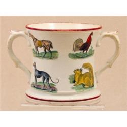 A Staffordshire pottery twin handled loving cup, circa 1860, of inverted flared form, printed and...