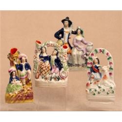 A Staffordshire pottery arbour group, circa 1880, a country couple seated courting and another St...