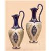 Image 1 : A pair of Royal Doulton pottery ewers, circa 1910, of slender ovoid form, with oval stylised flor...