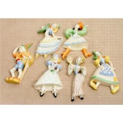 A Crown Devon wall plaque in the form of a Dutch girl, shape no 217, height 26cm, 14 1/4 inches,...