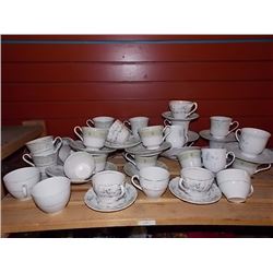 TEA CUPS AND SAUCERS