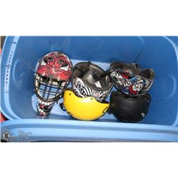 BIN W/ BIKE HELMETS AND HOCKEY HELMET