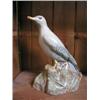 Image 1 : An E. Radford, England figure of a Seagull upon a rocky outcrop, 8 1/2" high....