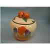 A Clarice Cliff, Newport Pottery, Crocus pattern Bizarre ware preserve pot with lid, 3 1/2" high....