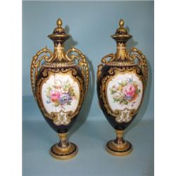 A pair of Royal Crown Derby heavily gilded and cobalt blue ground 10" vases with covers, central...