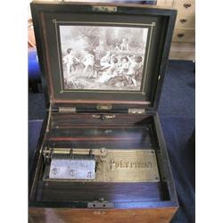 An Antique table top Polyphon, disc musical box, having front of case left to right handle windin...