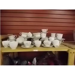 TEA CUPS AND SAUCERS