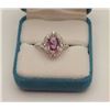 One ladies ring in 18k white gold set with an  oval pink sapphire weighing 2.0 ct and 0.50  ct of fi
