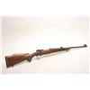Image 1 : Winchester Model 70 bolt action rifle, 7mm  Rem. Mag. caliber, 24” barrel, mat black  finish, checke