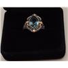 Image 2 : One 14k white gold ring with yellow accent  and set with a treated light blue sapphire  Est:$300-400