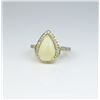 Image 2 : Marvelous Halo design ladies ring set with an  Australian Opal weighing approx. 5.00 carats  and sur