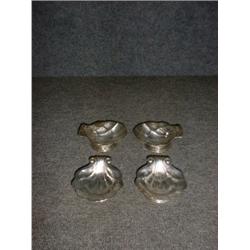 Un ensemble de 4 salières en argent de Petersen en forme de coquilles....
