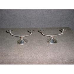 Une paire de bougeoirs doubles allemands en argent, (lestés)....