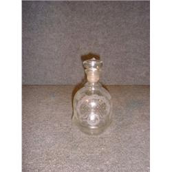 Une carafe en verre de Bohème à décor gravé d'antilope et de paysage....