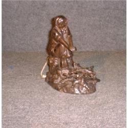 RIGUAL, P., Act. 1900-1925.  "La Chaleur du Brasier".  Lampe en bronze patiné....