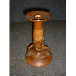 Un bougeoir en grès marron de Royal Doulton, vers 1900, le fût décoré d'une scène de chasse....