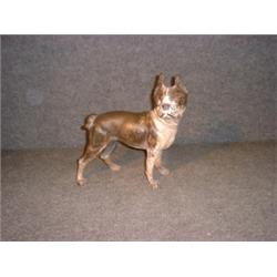 Un arrêtoir de porte en fonte en forme de carlin....