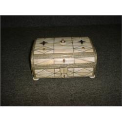 Un coffret indien en métal argenté recouvert d'ivoire et serti de pierres dures....