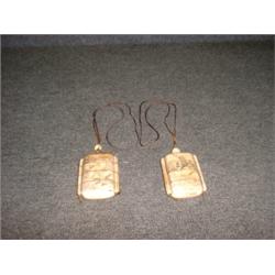 Deux inros en os à décor d'oiseaux et de scènes érotiques....