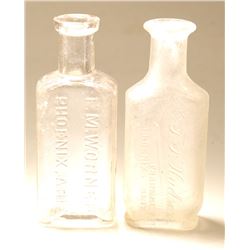 Two Different Phoenix Drug Bottles