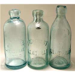 Three Different Schmidt Soda Bottles