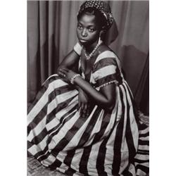 SEYDOU KE-TA (1921-2001) UNTITLED (YOUNG WOMAN WEARING A BLACK AND WHITE STRIPED DRESS) SIGNED AN...