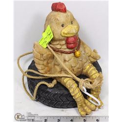 HANGING CHICKEN SITTING ON TIRE GARDEN